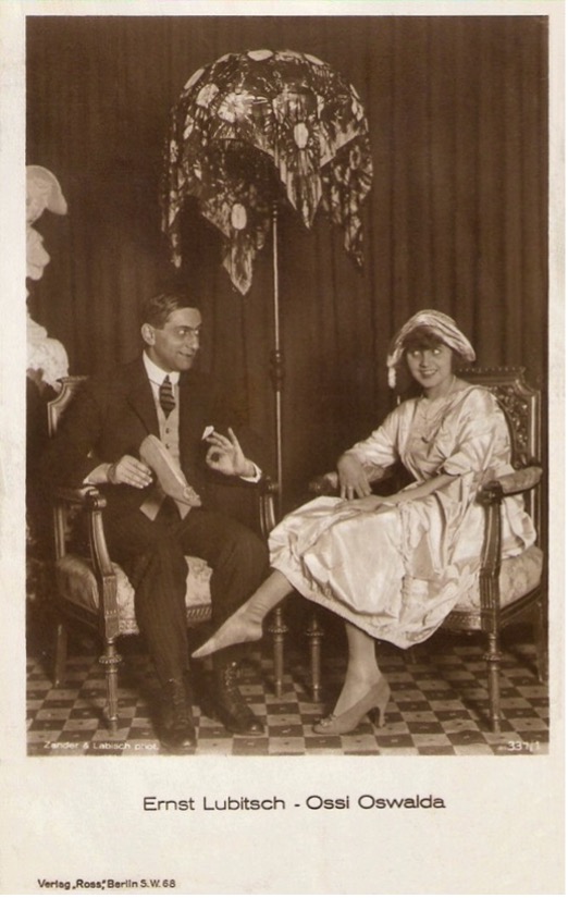 Postcard captioned "Ernst Lubitsch – Ossi Oswalda," the two seated together beneath an ornate lampshade.